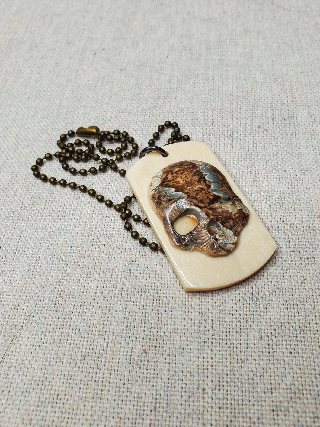 Large mammoth tooth dog tag skull