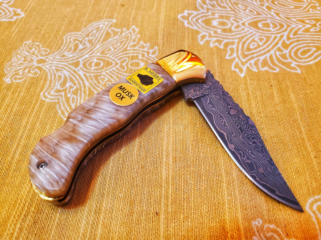 Brass Damascus folder with musk ox scales